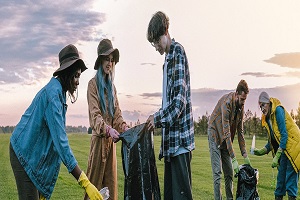 Photo of volunteers cleaning trash from a field